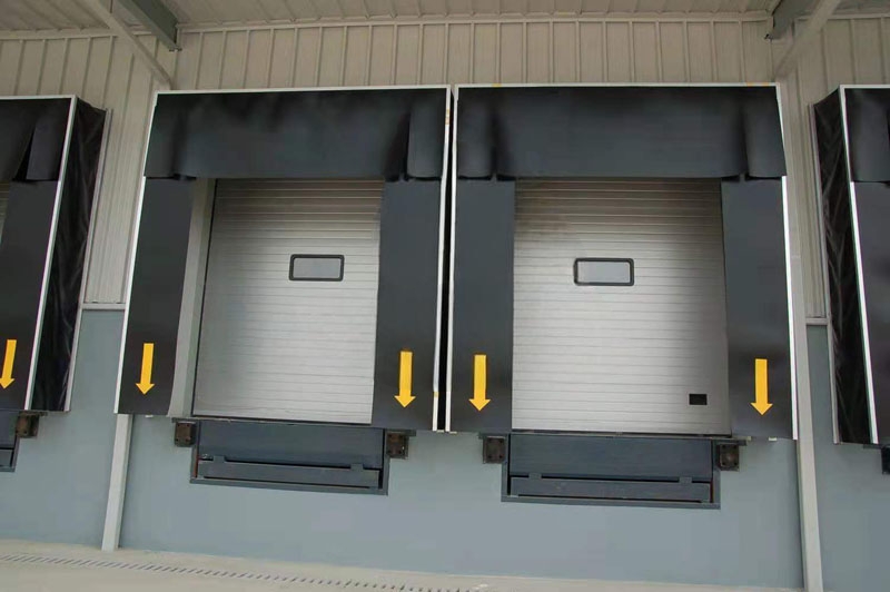 loading bay doors with dock shelter and sectional door support